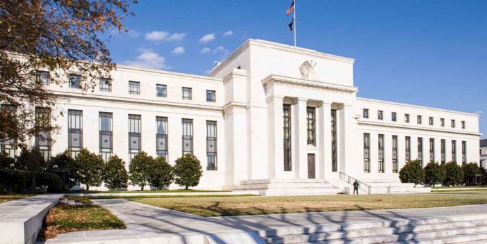 Fed Slashes Interest Rates As First Bank Tests Positive For Coronavirus